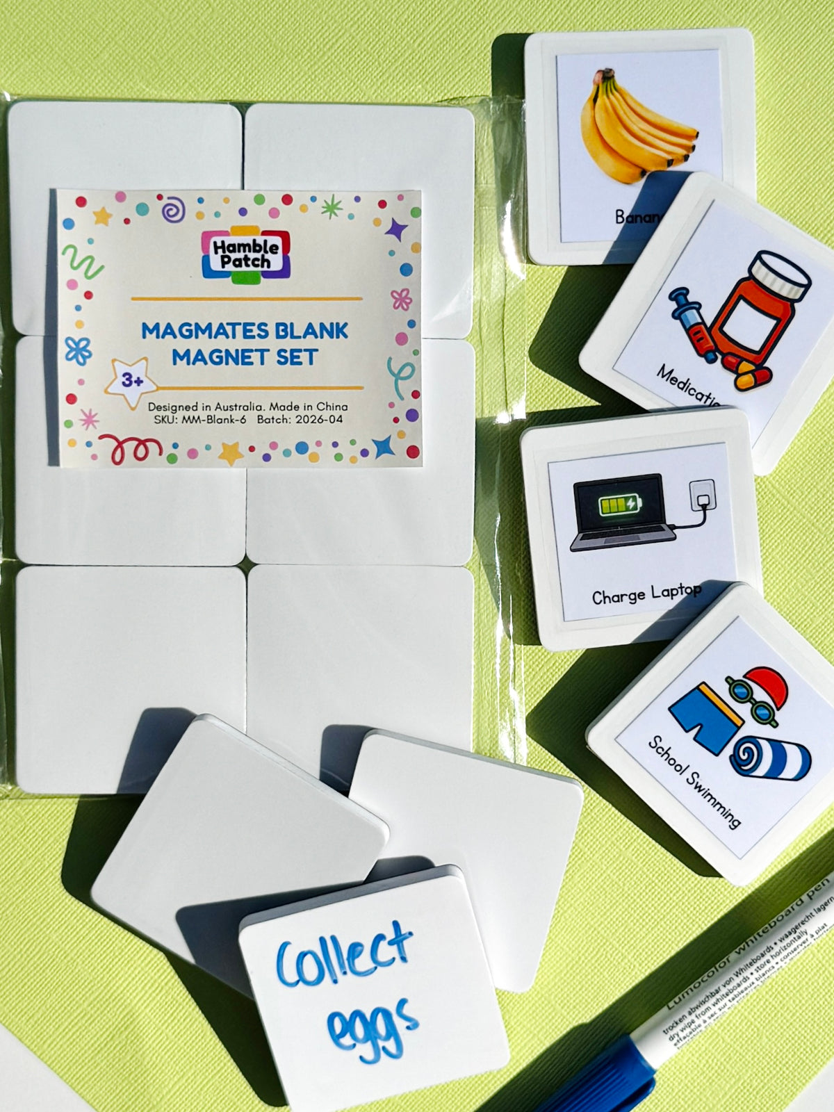 A set of white magnetic blank magnets with printed labels, shown alongside example magnets on a bright yellow-green textured background. The packaging label reads 'Hamble Patch MagMates BLANK MAGNET SET'.