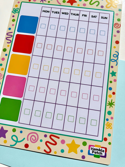 A colourful weekly planner board with days of the week in a grid and a column of bright colour squares on the left. The board has a decorative border and a visible Hamble Patch logo in the bottom right corner.