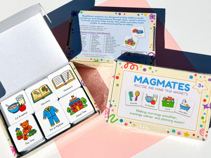 A boxed set of colorful children's task magnets shown open, with one magnet set displayed inside a white box and the package front visible beside it. The magnets feature illustrated icons for activities like Eat Breakfast, Show Play, Homework, and Play Time.