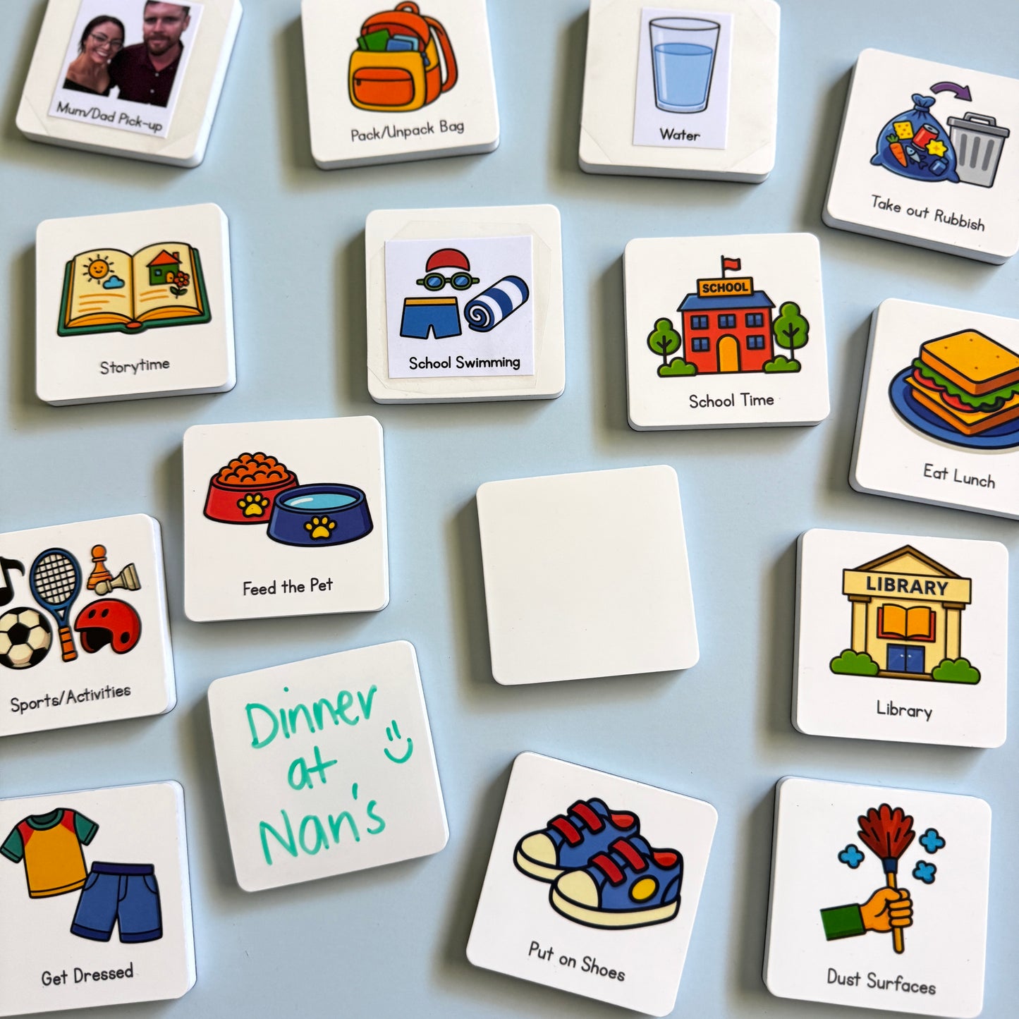 A selection of MagMates and MagMates blank magnets scattered on a blue background.